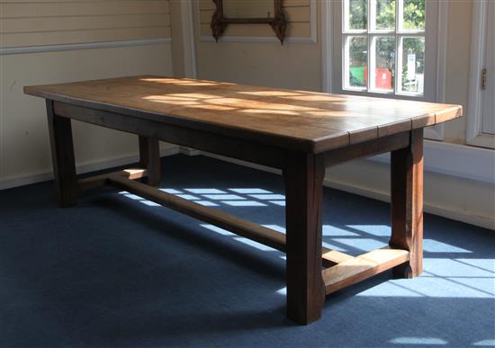 An 18th century style heavy oak refectory table, W.8ft 2in. D.2ft 11in. H.2ft 6in.